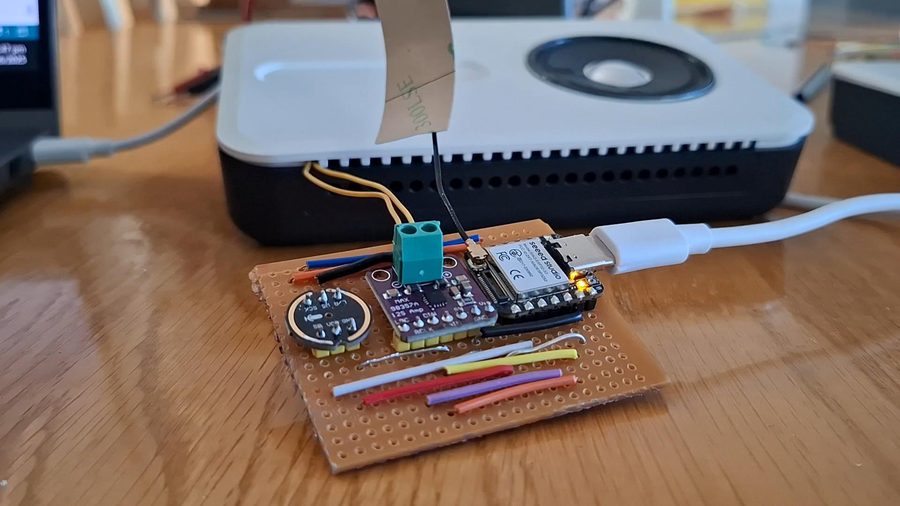 ESP32-based conversational AI bot on a soldered protoboard