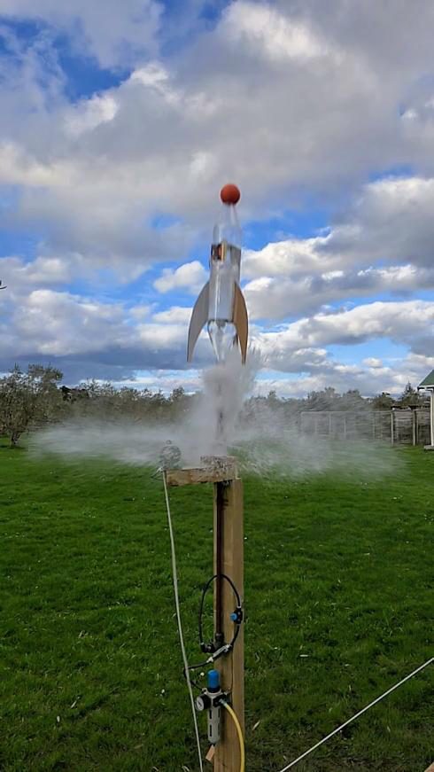 A water bottle rocket launching from Tom's launcher